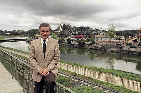 Television evangelist Jim Bakker poses in front of the Water Park in Columbia, SC, one of the attractions at his Heritage USA, March 19, 1987.