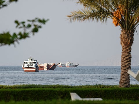 Ships are anchored off the coast of Khasab in Oman’s Musandam Governorate, near the Strait of Hormuz.