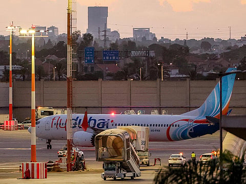 The flydubai (flight FZ1073) Boeing 737 MAX 8 is pictured on the tarmac after landing at Israel's Ben Gurion Airport in Lod on September 30, 2026. Investigation reveals alleged attack preparations, crew intervention and questions around recruitment checks.