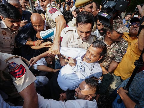 Aam Aadmi Party (AAP) National Convenor Arvind Kejriwal being detained by Delhi Police during a protest against CEC Gyanesh Kumar, in New Delhi on Saturday.