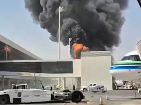 This image from video obtained and verified by AP shows thick black smoke and flames rising from a fire at King Khalid International Airport in Riyadh, Saudi Arabia, on Friday, October 9, 2026.
