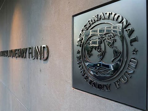International Monetary Fund (IMF) logo is seen outside the headquarters building in Washington, US. (Photo/Reuters)