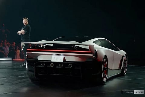 A grab taken on October 16, 2026 from a live feed released by Tesla shows Tech billionaire Elon Musk unveiling on October 15 the next-generation Roadster electric car in McGregor, Texas, United States.