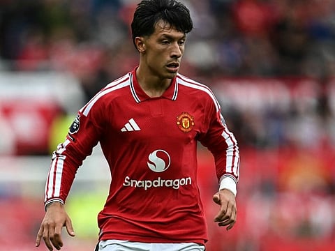 Manchester United's Argentinian defender #06 Lisandro Martinez dribbles the ball during the English Premier League football match between Manchester United and Ipswich Town at Old Trafford in Manchester, north west England, on August 30, 2026.