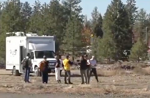 People gather outside Silver Rail Elementary School in Bend, Oregon, after reports of a shooting on Thursday, Oct. 15, 2026.