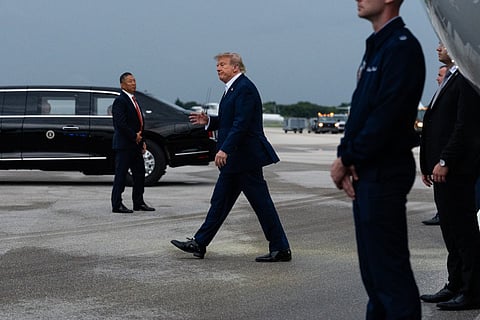 President Donald Trump exits Air Force One at President Donald J. Trump International Airport in West Palm Beach, Florida.