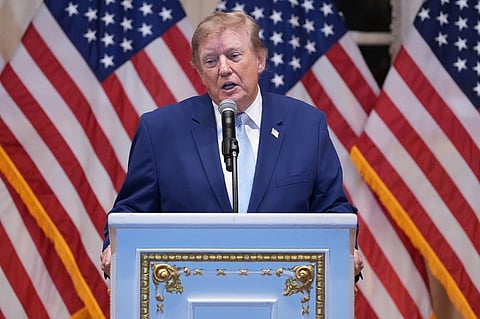President Donald Trump speaks at a dinner at his Mar-a-Lago club.