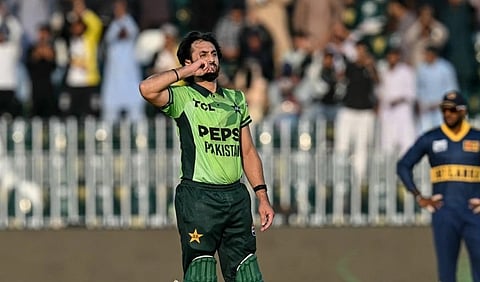 Pakistan's Salman Agha (C) celebrates after scoring a century (100 runs) as teammate Arafat Minhas (L) watches during the tri-series one-day international (ODI) cricket match between Pakistan and Sri Lanka at the Rawalpindi Cricket Stadium in Rawalpindi on October 18, 2026.