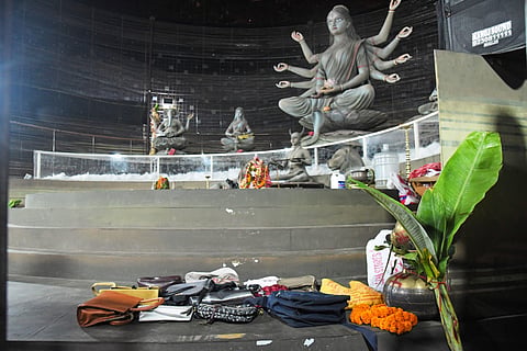 Purses and other belongings left behind by devotees lie on the floor of a worship venue for the Hindu festival of Durga Puja following a stampede, in Kolkata, on October 17, 2026.