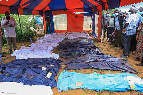 FILE - Body bags are laid out at the scene where dozens of bodies, believed to be followers of extremist evangelical leader Paul Mackenzie, were found in shallow graves in the village of Shakahola, near the coastal city of Malindi, in southern Keny, April 24, 2023. (AP Photo, File)