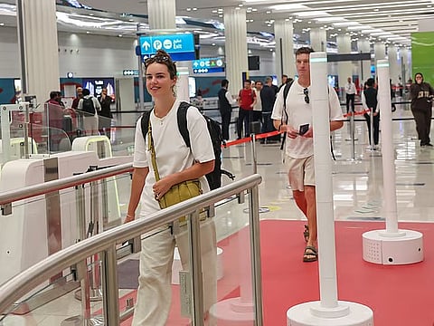 Passengers using 'Red Carpet' smart corridor, a biometric immigration system, at Dubai International Airport Terminal-3 that allows passengers to complete passport control in seconds.