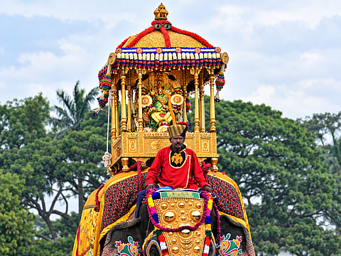 A mahout sits in front of the 750kg Golden Howdah carrying the idol of Goddess Chamundeshwari during the Jamboo Savari procession on Vijayadashami, marking the grand finale of Mysuru Dasara in Karnataka, India.