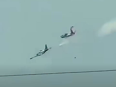 Both planes went down within air base perimeter; no other casualties reported.