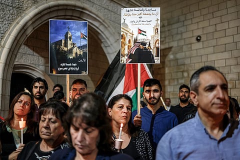 Mourners attend a vigil at the Greek Orthodox Church of the Transfiguration in the Palestinian city of Ramallah in the Israeli-occupied West Bank, on October 26, 2026, in solidarity with the victims of an attack on the Church of St George in Jordan's village of Hammoud on October 23.