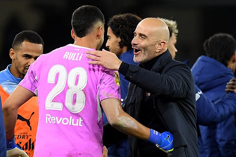 Manchester City's Italian manager Enzo Maresca hugs Manchester City's Argentinian goalkeeper #28 Geronimo Rulli following the English League Cup fourth round football match between Manchester City and Brighton and Hove Albion at the Etihad stadium in Manchester, north-west England on October 28, 2026.