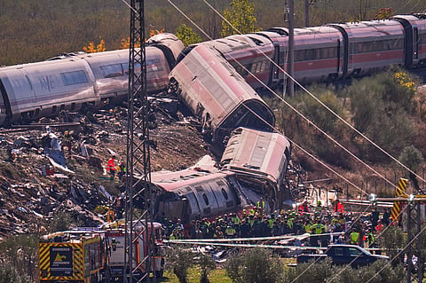 Emergency services work at the scene of a collision between two trains in Urda, Spain, on Wednesday, Oct. 28, 2026. (AP Photo/Manu Fernandez)