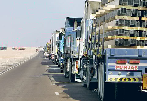 Trucks form an eight kilometre long line near Al Ghuwaifat waiting for their turn to cross the Saudi Arabia-UAE border.