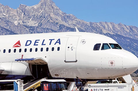 A Delta Air Lines plane at Jackson Hole airport in Wyoming. The airline will drop service to 11 midsize US cities next month amid weak demand because of the Covid-19 pandemic.