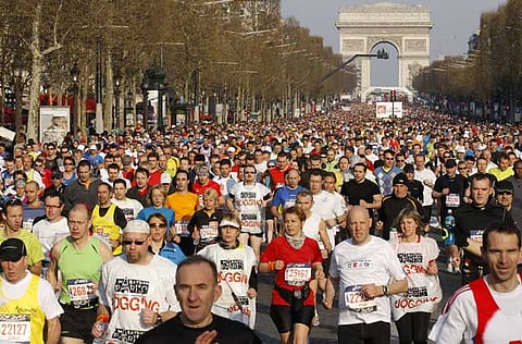 Thousands of competitors during the Paris Marathon down the Champs Elysees in Paris.
