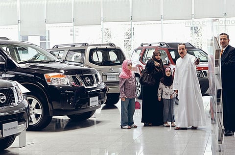 Customers check out the various models on display at a car showroom in Dubai. Picture used for illustrative purposes.