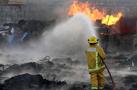 Firefighters extinguishing a fire in a building in Sharjah. For illustrative purposes only.