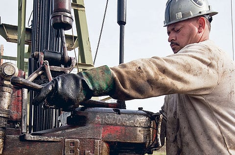 Oil prices nudged lower after a report showed rising US crude stockpiles, a reminder that the pandemic continues to have a damping impact on demand.