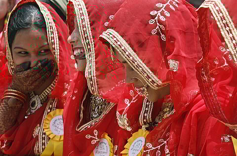 File photo for illustrative purposes only: Muslim brides attend a mass wedding ceremony in India
