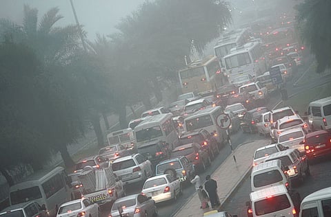 Traffic on a fog-laden morning in Abu Dhabi. The new app feature will alert motorists about unstable weather conditions. Picture for illustrative purposes only.