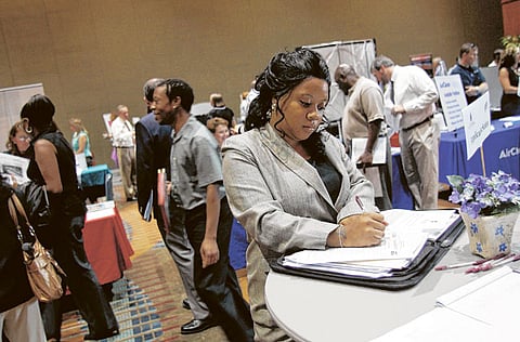 A job seeker fills out an application form.