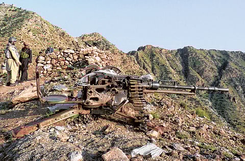 Pakistani soldiers stand guard at a mountain checkpost near the Afghan border in theKhyber tribal region.