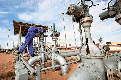 Valves are adjusted at the Amaal oil field in eastern Libya. Oil prices could see prices going up in the short term with a disruption in supply after oil production in Libya was down by 800,000 barrels.
