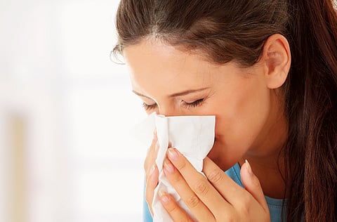 Sneezing and a runny nose can be a sign of allergic rhinitis.