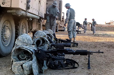 File photo: US soldiers prepare their gear prior to departing a base in Iskandariyah, south of Baghdad, on December 8, 2011.