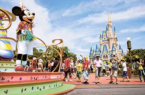 Florida’s Walt Disney World theme park reopened Saturday in a state hard hit by the coronavirus, as the World Health Organization issued a fresh warning that countries should step up pandemic restrictions.