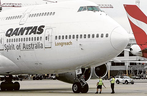 Qantas planes at Sydney International Airport. From Monday, any traveller into Australia who has been in India in the past 14 days could face fines and jail time.