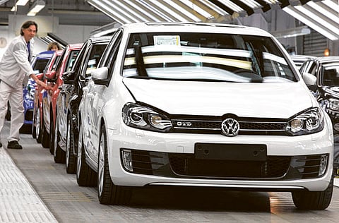 A worker carries out the final check on a VW automobile at the
Volkswagen AG factory in Wolfsburg, Germany. Automobile sales
are picking up after the slump during recession.
