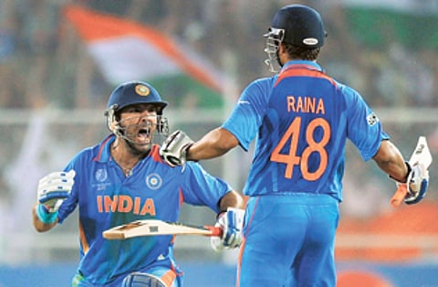 Yuvraj Singh (left) celebrates with Suresh Raina after scoring the winning runs against Australia in the 2011 World Cup quarter-final.