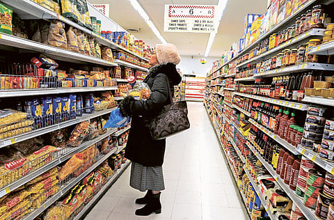 A woman shops for groceries at a supermarket in Brooklyn, New York. US inflation has surged thanks to pandemic-related problems, including shipping trouble as strong demand for goods from Asia and elsewhere has taxed freight routes and pushed transit costs higher.