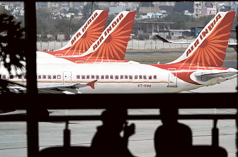 India's airline industry is particularly vulnerable to any downturn. A 40-50 per cent demand dip could lead to as many as 150 aircraft being grounded. File picture of Air India jets at Indira Gandhi International Airport in New Delhi.