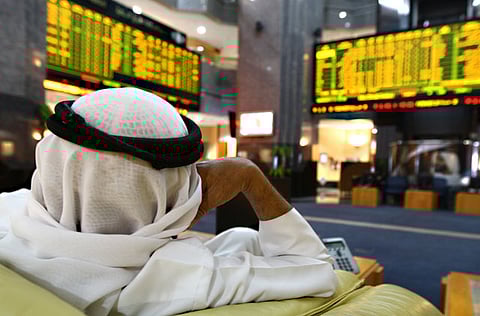 A UAE investor monitors stocks at the Abu Dhabi's Security Market.