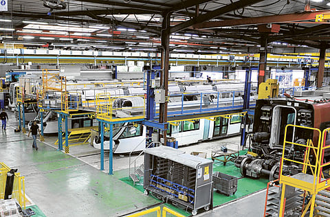 Alstom trains sit on the assembly line at the Alstom SA factory in Aytre, France. Alstom will open exclusive talks with Skoda Transportation to sell its plant in Reichshoffen, North Eastern France.