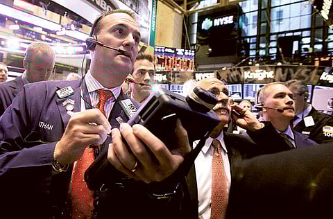 US stocks shook off early declines and closed out the last trading day of the month with modest gains on Friday as a rise in Microsoft helped offset declines in Amazon and Apple.