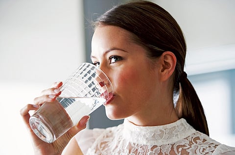 Start the day with a glass of lemon water.