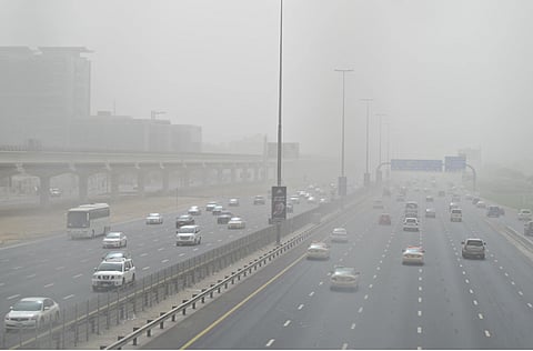 A view of vehicles negotiating the sand storm on Shaikh Zayed Road, Dubai. Photo for illustrative purposes only
