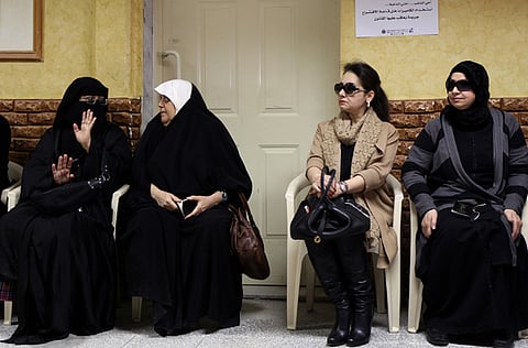 Kuwaiti women wait outside a polling station in Kuwait City. As the 2020 Kuwait National Assembly elections are approaching, an online platform, Mudhawi’s List, has been launched to support women running for office.