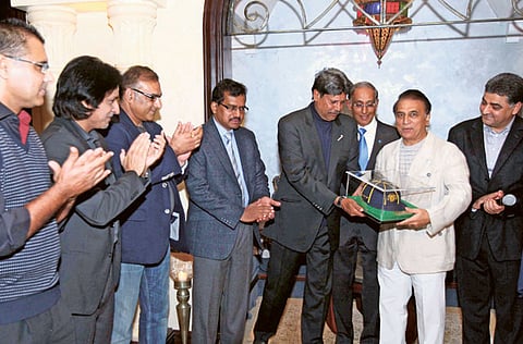 Sunil Gavaskar receiving the Hall of Fame cap by Kapil Dev in the presence of former greats in Dubai a few years back.