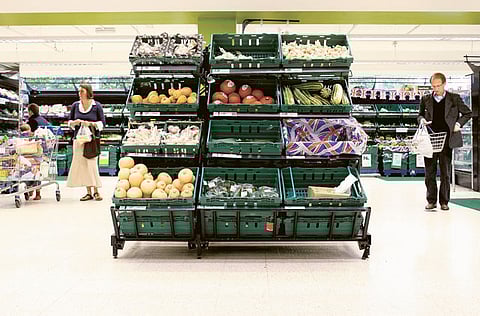 Customers browse through the fresh produce at a Tesco supermarket in London. Britain could face gaps on supermarket shelves this summer and an "unimaginable" collapse of supply chains after the pandemic and Brexit led to a shortage of more than 100,000 truck drivers.