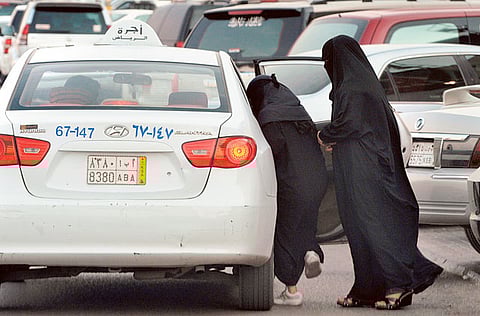Saudi women get into a taxi outside a shopping mall in Riyadh. The Saudi government has agreed to allow taxis and other vehicles to carry advertisements.