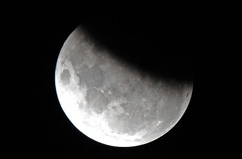 The moon is 37 per cent obscured by the Earth's shadow during the partial lunar eclipse above Sydney.