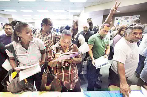 Job seekers attend the 11th annual Skid Row Career Fair in Los Angeles. Economists predicted the official U.S. unemployment rate would hit 20% - or really close to it - in May. Instead, the world learned Friday morning that the official rate is actually 13.3%.